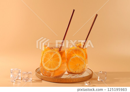 Modern still life with citrus fruits. Diet vegan cocktail with oranges, lemon and chia seeds, detox diet and weight loss concept, healthy lifestyle and healthy nutrition advertising, cafe menu 125195983