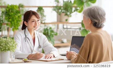 Gentle health consultation between young female doctor and elderly patient 125196819