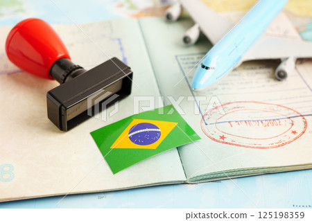 Brazil passport with approved stamp on document for tourism to immigration at airport in country. 125198359