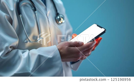 A medical professional presents a smartphone with a blank screen, highlighting the role of telemedicine in modern healthcare 125198956