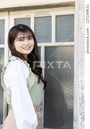 Standing female portrait 125199631