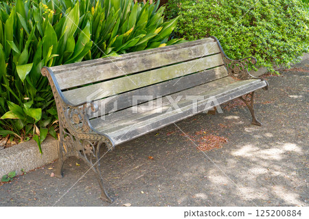 Old wooden bench in the park 125200884