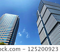 A skyscraper rising in the blue sky 125200923
