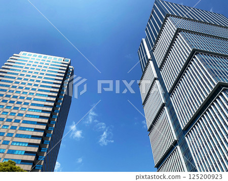 A skyscraper rising in the blue sky A skyscraper rising in the blue sky 125200923