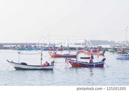 fishing boat in the sea near the port 125201205
