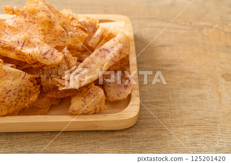 Taro Chips - fried or baked sliced taro Taro Chips - fried or baked sliced taro 125201420