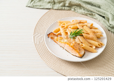 salmon with penne pasta cream sauce salmon with penne pasta cream sauce 125201429