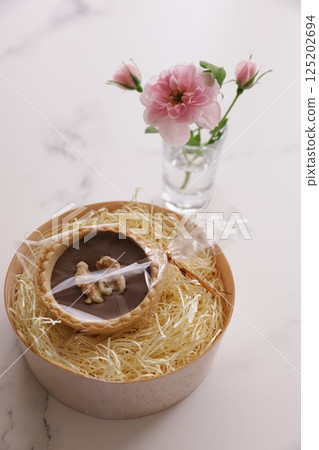 Mini roses and chocolate candy 125202694