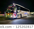 Bus running late at night 125202817
