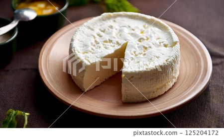 Rich and creamy clotted cheese cross section 5 125204172