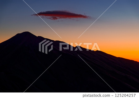 Mount Dainichi in the afterglow as seen from Mount Gonishi in the Iide mountain range Mount Dainichi in the afterglow as seen from Mount Gonishi in the Iide mountain range 125204257