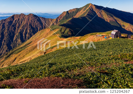 Morning view of Onishi hut and Mt. Dainichi from Mt. Onishi in the Iide mountain range 125204267