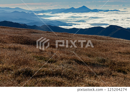 Autumn foliage along the ridge of Mt. Gonishi in the Iide mountain range and Mt. Bandai Autumn foliage along the ridge of Mt. Gonishi in the Iide mountain range and Mt. Bandai 125204274