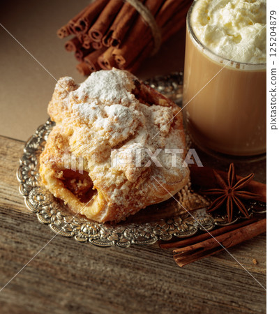 Vienna strudel and caffe latte on a silver tray. Vienna strudel and caffe latte on a silver tray. 125204879
