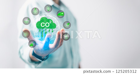 Reduce CO2 emission concept in hand for environmental, global warming, Sustainable development and green business based on renewable energy. Industrial emissions pollute environment and ecosystems. Reduce CO2 emission concept in hand for environmental, global warming, Sustainable development and green business based on renewable energy. Industrial emissions pollute environment and ecosystems. 125205312