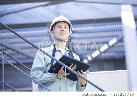 Workers working at a construction site. Photo courtesy of Denpa Gakuen, Tokyo Electronics College. Workers working at a construction site. Photo courtesy of Denpa Gakuen, Tokyo Electronics College. 125205750