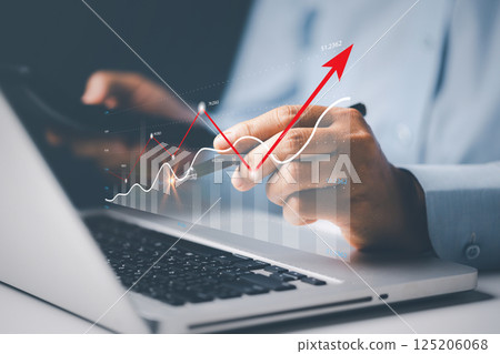 Businesswoman pointing virtual technical graph, chart for analysis stock market, technology investment, value investment concept. Investor data analysis for planning in strategy of stock market fund. Businesswoman pointing virtual technical graph, chart for analysis stock market, technology investment, value investment concept. Investor data analysis for planning in strategy of stock market fund. 125206068