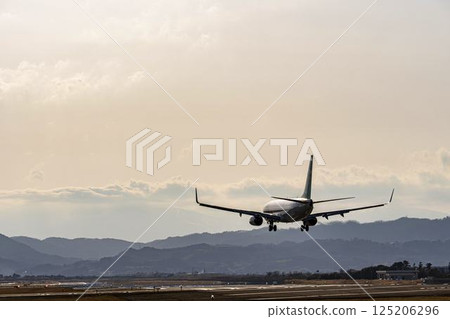 Sendai Airport at dusk, airplane landing, Natori City, Miyagi Prefecture Sendai Airport at dusk, airplane landing, Natori City, Miyagi Prefecture 125206296