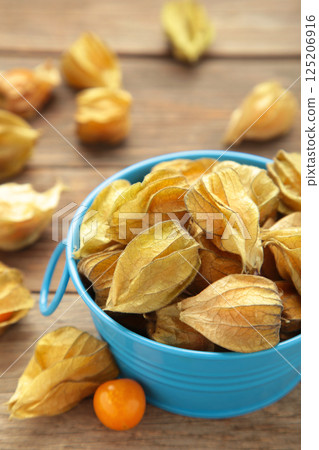 Ripe physalis on grey wooden background. Top view 125206916
