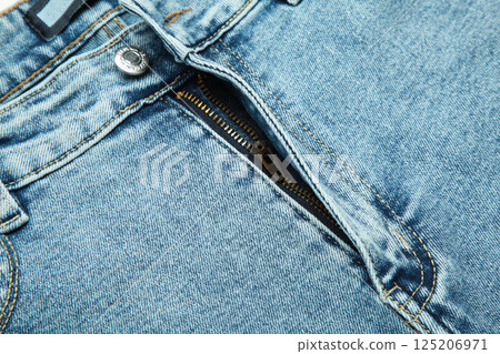 Closeup view of blue jeans with zipper as background Closeup view of blue jeans with zipper as background 125206971