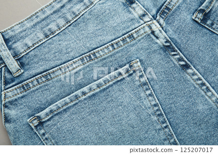 Jeans background, denim with seam of fashion design Jeans background, denim with seam of fashion design 125207017