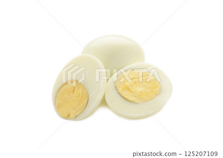 Whole white egg and halved boiled egg with yolk isolated on white background. Whole white egg and halved boiled egg with yolk isolated on white background. 125207109