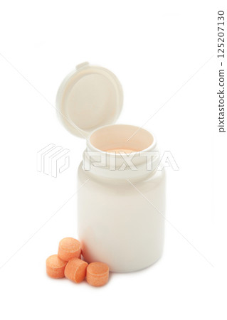 Vitamin C pills with jar isolated on white background. 125207130