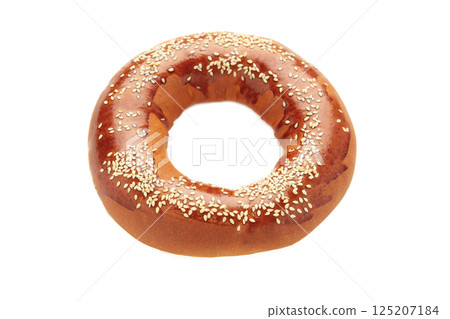 Fresh bread bagel with poppy seed isolated on white background. 125207184