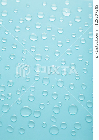 Water drops on blue background. Space for text Water drops on blue background. Space for text 125207285