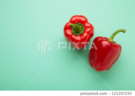 Red pepper on mint background. Space for text Red pepper on mint background. Space for text 125207293