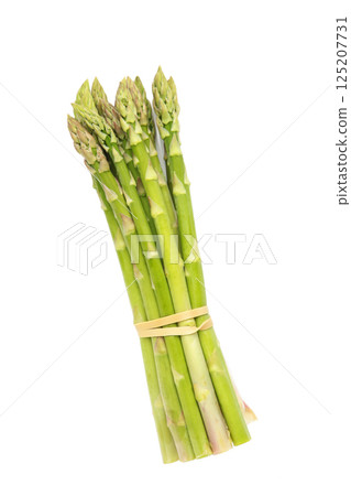 Fresh green asparagus on a white background Fresh green asparagus on a white background 125207731