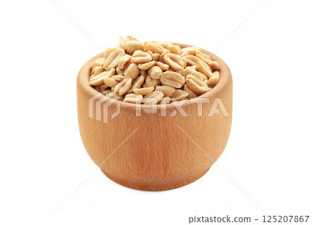 Roasted peanuts in bowl isolated on a white background Roasted peanuts in bowl isolated on a white background 125207867