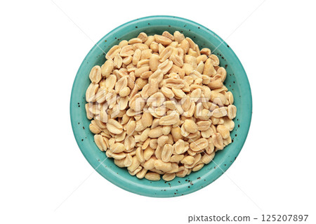 Roasted peanuts on plate isolated on white background 125207897