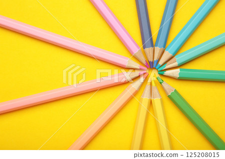 Pastel color pencils on yellow background. Space for text Pastel color pencils on yellow background. Space for text 125208015