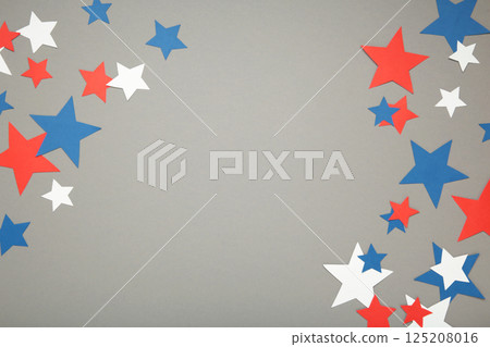 American independence day, celebration, patriotism and holidays concept - red, white and blue paper stars on grey background. American independence day, celebration, patriotism and holidays concept - red, white and blue paper stars on grey background. 125208016