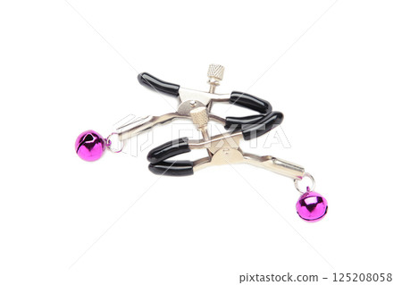 Nipple clamps made of metal with pink bells isolated on white background. BDSM Sex games. Nipple clamps made of metal with pink bells isolated on white background. BDSM Sex games. 125208058