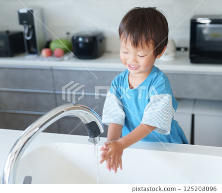 A child washing hands A child washing hands 125208096