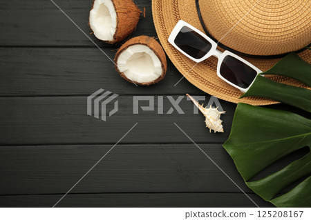 Summer accessories with coconuts on black background. 125208167