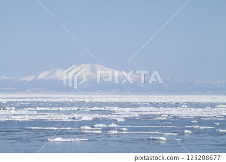 View of drift ice in the Sea of Okhotsk from the window of the Senmo Main Line train. Drift Ice Story Train and Drift Ice Norokko Train View of drift ice in the Sea of Okhotsk from the window of the Senmo Main Line train. Drift Ice Story Train and Drift Ice Norokko Train 125208677