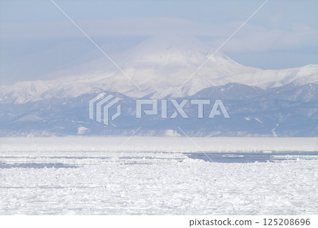 View of drift ice in the Sea of Okhotsk from the window of the Senmo Main Line train. Drift Ice Story Train and Drift Ice Norokko Train 125208696