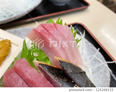 Yellowtail, tuna, and bonito tataki 125209115