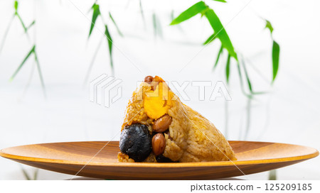 Traditional Chinese glutinous rice dumplings showing their rich fillings 125209185
