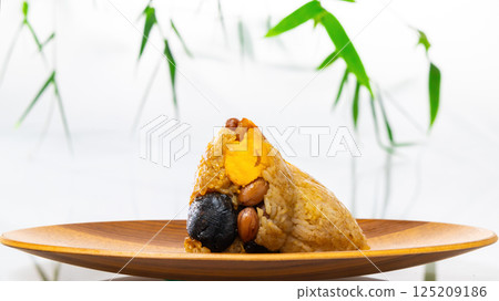Traditional Chinese glutinous rice dumplings showing their rich fillings 125209186