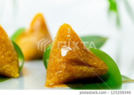 Delicious sweet rice dumplings topped with honey 125209340