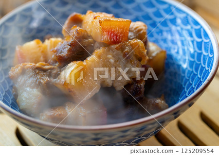 Fragrant steamed pork belly on bamboo steamer Fragrant steamed pork belly on bamboo steamer 125209554