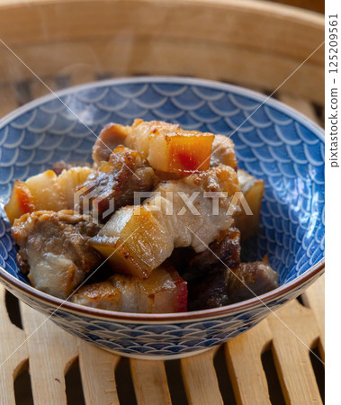 Fragrant steamed pork belly on bamboo steamer Fragrant steamed pork belly on bamboo steamer 125209561