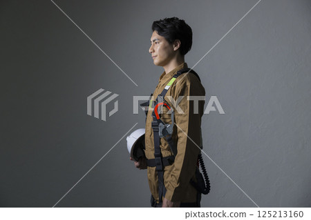 Male worker wearing a full harness Male worker wearing a full harness 125213160