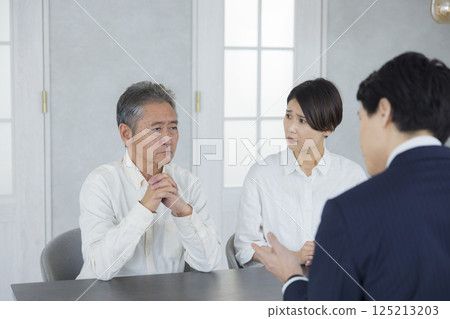 Salesman, senior and family having a meeting 125213203