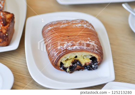 Chocolate Pain Suisse, Chocolate Pain Suisse or Bestill chocolate suisse or Pain Suisse or decadent traditional French pastry or swiss bread Chocolate Pain Suisse, Chocolate Pain Suisse or Bestill chocolate suisse or Pain Suisse or decadent traditional French pastry or swiss bread 125213280
