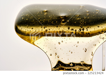 Photo of a sugar paste for depilation hair removal procedure. Texture. 125213424